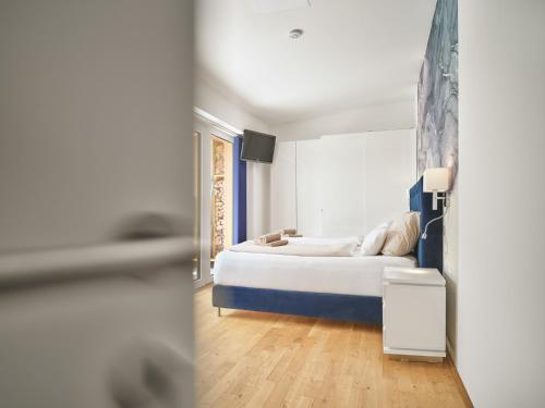 a bedroom with a bed and a window at The Mountain Suite Top 11 - Tauplitz Residences by AA Holiday Homes in Tauplitz