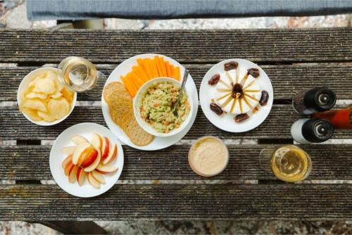 a table with four plates of food on it at Tranquility Tiny House by Tiny Away in Owaka