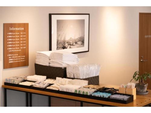 a pile of towels on top of a table at Hotel Emit Shibuya - Vacation STAY 40892v in Tokyo