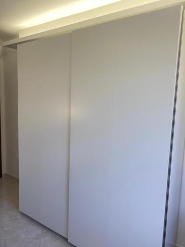 an open door in a room with white walls at Casa Isa in Narni Scalo