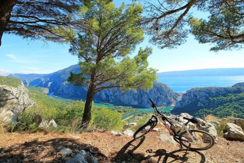 a bike parked on the side of a mountain at NEW Apartment Gironi with Pool, Jacuzzi in Tugare
