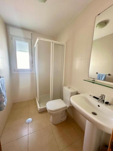 a bathroom with a shower and a toilet and a sink at VILLA IZAN in Alhama de Murcia