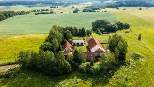 an aerial view of a house in a field at Złota Wójtówka in Wydminy