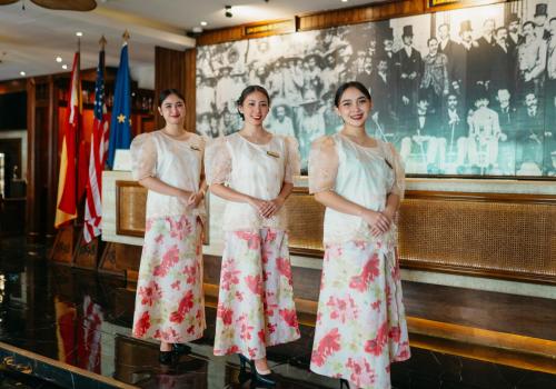a group of three women standing next to each other at 1898 Hotel Colonia En Las Filipinas in Manila