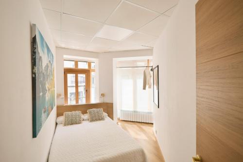 Ένα ή περισσότερα κρεβάτια σε δωμάτιο στο Apartamento Moroy