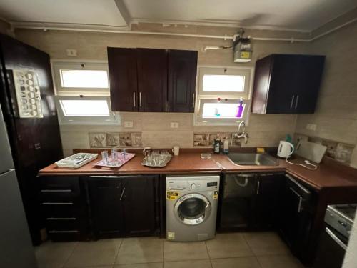 A kitchen or kitchenette at El Rehab city Cozy apartment 3 bedrooms