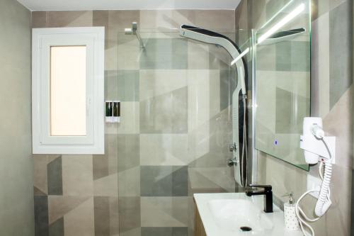 a bathroom with a sink and a shower at Gaviotas Beach Golf in Almerimar