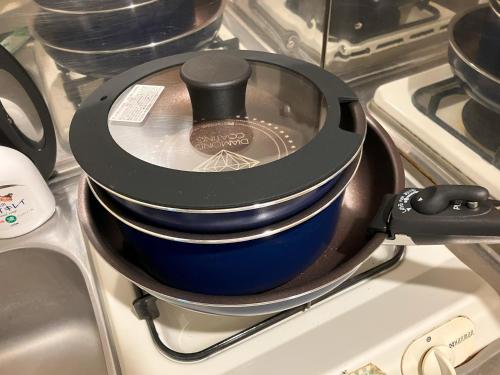 a pot sitting on top of a stove at Chill out FUKUOKA in Fukuoka