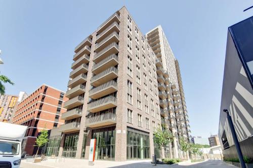 a tall building on a city street at Repton Gardens at Wembley Park in London