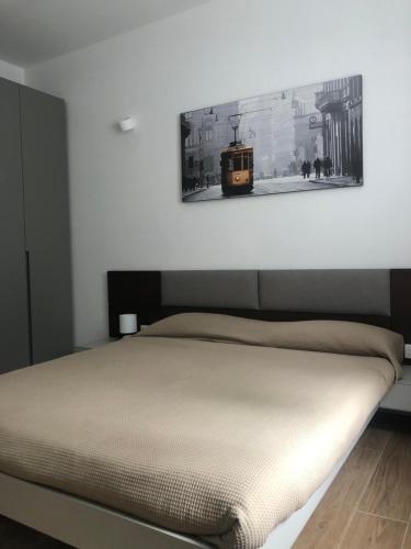 Ένα ή περισσότερα κρεβάτια σε δωμάτιο στο Milano MISSORI Rose garden view