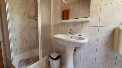 a bathroom with a sink and a shower at Apartment Siofok, Somogy 7 in Siófok