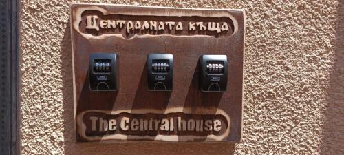 a cell phone dispenser on the side of a wall at The Central House 1 in Burgas City