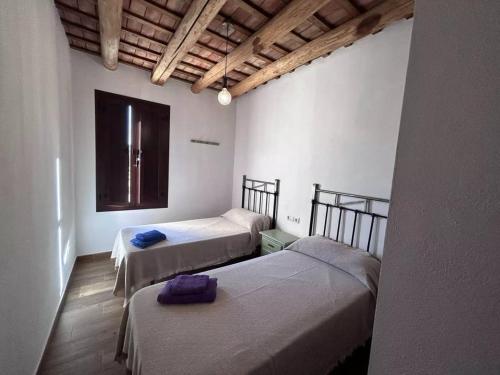 Ένα ή περισσότερα κρεβάτια σε δωμάτιο στο Casa Rural La Charquera