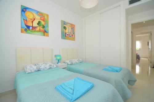 Ένα ή περισσότερα κρεβάτια σε δωμάτιο στο Penthouse Punta prima Torrevieja