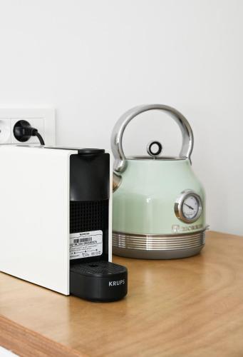 a toaster sitting next to a box on a table at Papafragas Studios in Pachaina