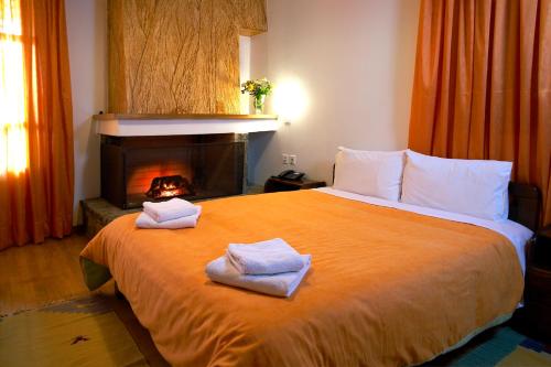 Ένα ή περισσότερα κρεβάτια σε δωμάτιο στο Ξενοδοχείο Σεμέλη