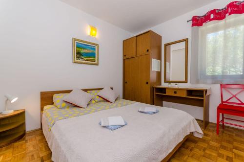 Llit o llits en una habitació de Apartments Pharos