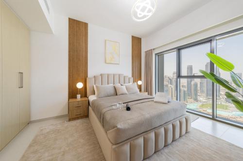 Postel nebo postele na pokoji v ubytování EDEN'S Homes & Villas - Burj Royale