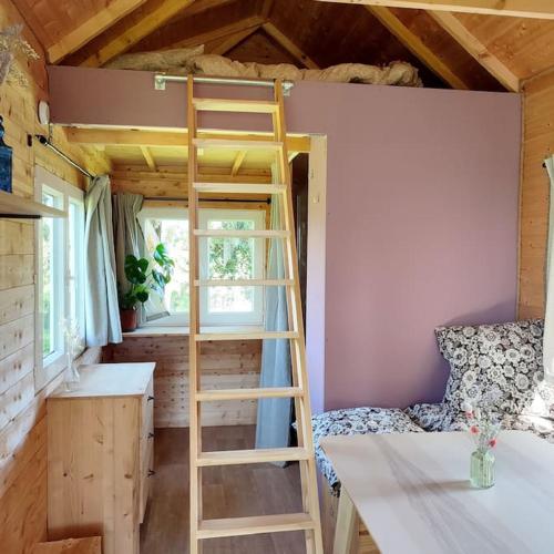 Postel nebo postele na pokoji v ubytování Nuit insolite en Tiny House
