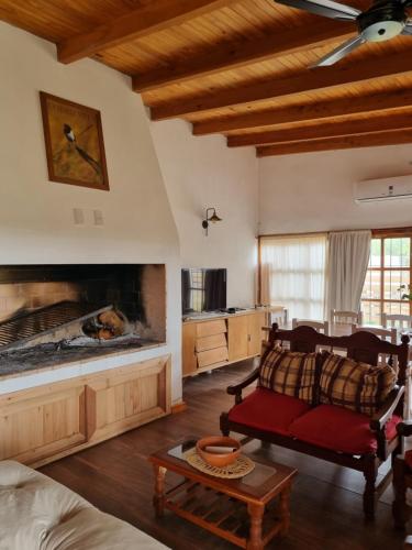 a living room with a couch and a fireplace at La Blanca in Mercedes