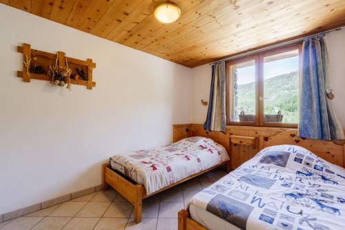 Ένα ή περισσότερα κρεβάτια σε δωμάτιο στο Primevère