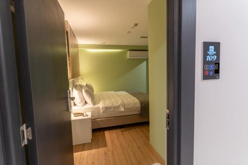a bedroom with a bed in a small room at Yusufhan Suites in Trabzon