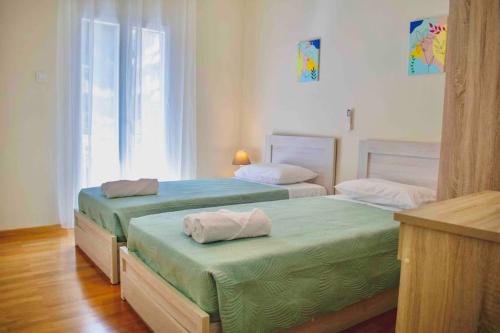Postel nebo postele na pokoji v ubytování Metaxa apartment