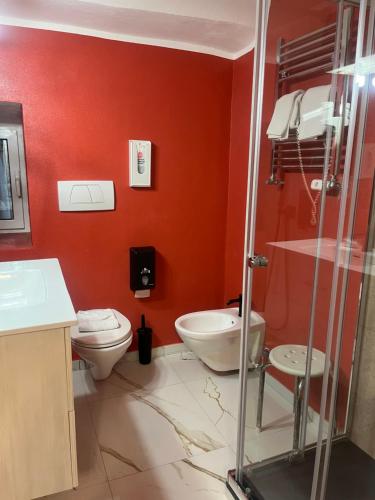 a bathroom with a toilet and a sink at Hotel Veronese in Genoa