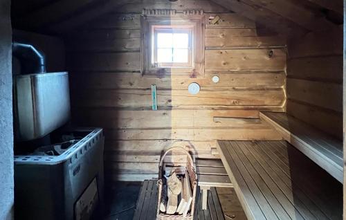 a small kitchen with a stove and a window at Awesome Home In Aurdal With Sauna in Aurdal