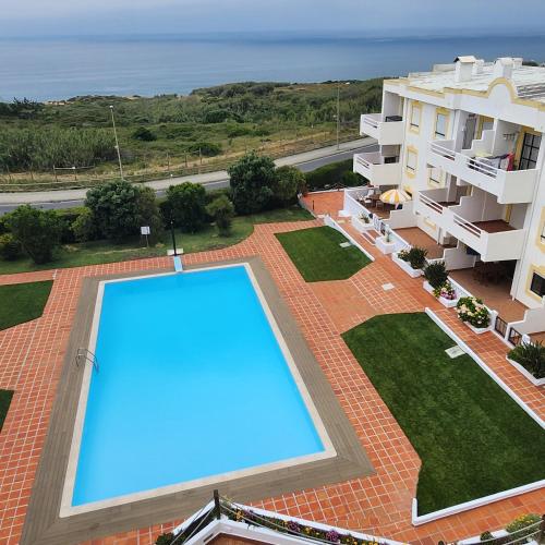 a large swimming pool on the roof of a building at Ericeira penthouse with total sea view in Ericeira