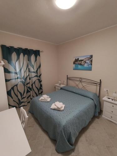 Postel nebo postele na pokoji v ubytování Agriturismo Maremma Amara