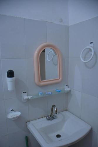 a bathroom with a sink and a mirror at Besham Inn, Besham in Besham
