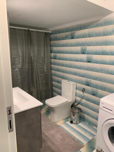 a bathroom with a toilet and a sink at Aura Estiva in Agia Triada