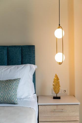 a bedroom with a bed and a nightstand with a lamp at Brikis Villa 3 - With Privae Pool in Balíon