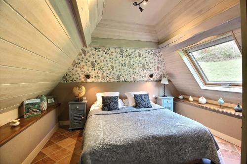 En eller flere senge i et værelse på Les Fermes Familles Bonte Bien être et nature