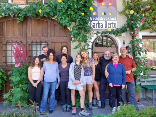 a group of people standing in front of a building at Bed & Breakfast Barba Bertu in Frassino