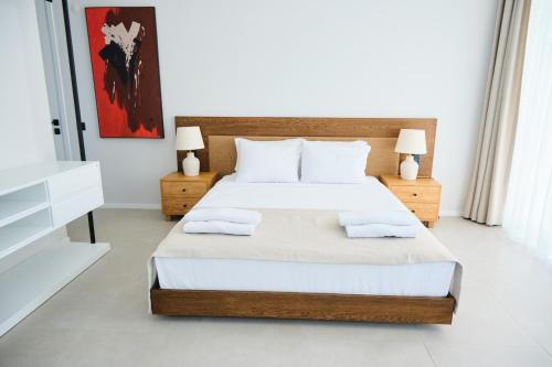 Postel nebo postele na pokoji v ubytování Ashta Suites - Cozy Suite