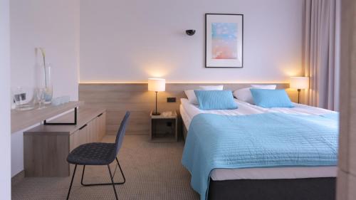 Säng eller sängar i ett rum på Hotel FairPlayce