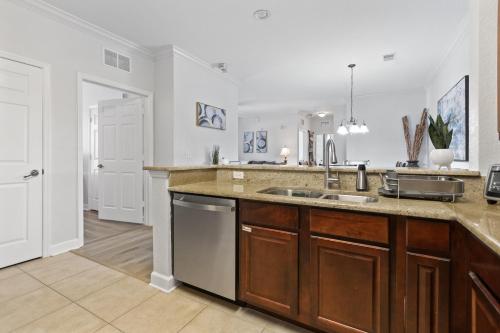 a kitchen with a sink and a counter top at Near Disney w/ pool-3BR/2BA-Spacious & Cozy Condo in Davenport