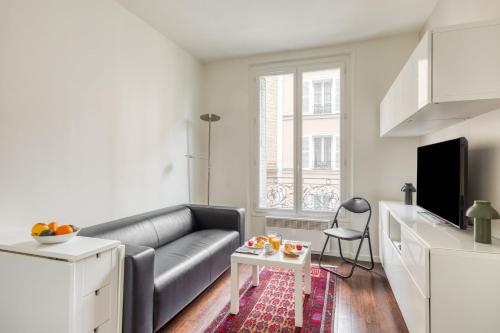 O zonă de relaxare la GuestReady - Charming Apartment Close to Bercy
