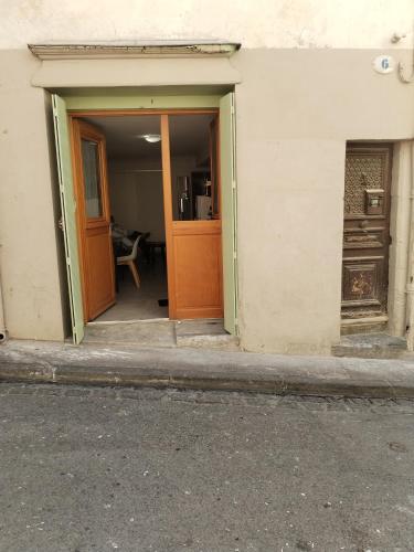 an open doorway of a building with a door at Magistic Handi in Perpignan