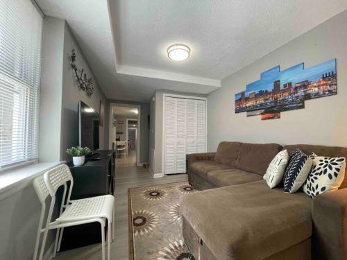 a living room with a couch and a table at Discover Charm City from a Cozy Retreat in Baltimore
