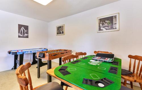 a dining room with a table and a tableablish at Beautiful Home In Budrovac With Wi-Fi in Budrovac