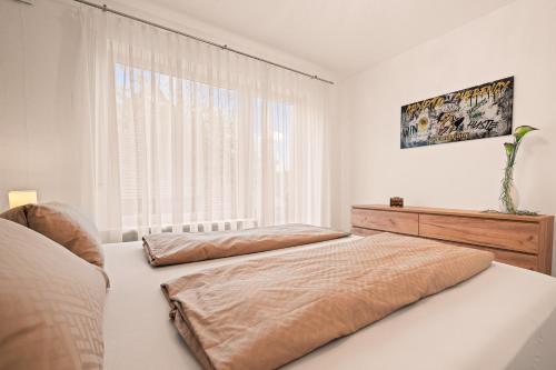 Ένα ή περισσότερα κρεβάτια σε δωμάτιο στο Prestige 2 Apartment