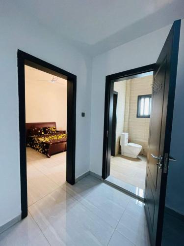 a room with a door leading to a bedroom at DSD-Apartments 2 in Brusubi