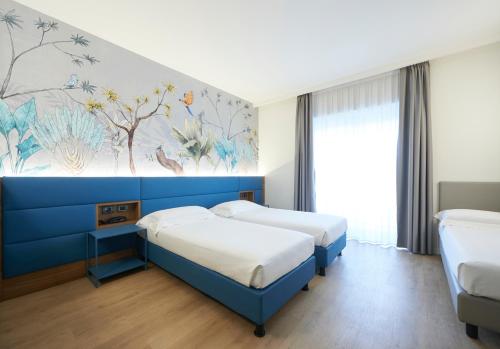 Postel nebo postele na pokoji v ubytování Palace Hotel Zingonia