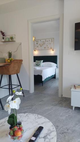 a bedroom with a bed and a table with a bowl of fruit at Modern Luxury Apartment Diva 3, 4 stars, Čiovo, Okrug in Trogir