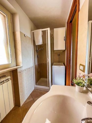 a bathroom with a tub and a shower and a sink at Casa con Abbonamento Parcheggio - Casa Nostra in Gaeta