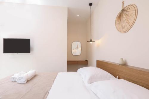 Ένα ή περισσότερα κρεβάτια σε δωμάτιο στο Olive Green Suites, Sidari
