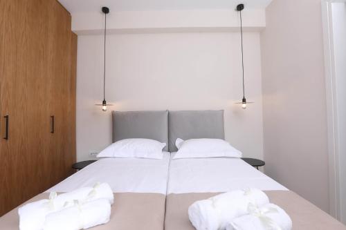 Ένα ή περισσότερα κρεβάτια σε δωμάτιο στο Olive Green Suites, Sidari